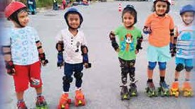 Little skaters in full protective gear