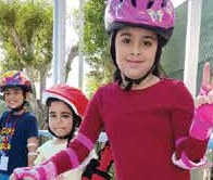 Smiling young skaters in helmets